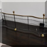 D07. Black and brass fireplace fender. 17”h x 51”w x 12”d 